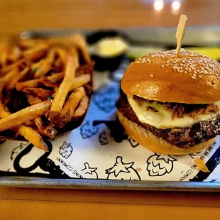 75-day dry-aged burger with fries, pickle spear, and kewpie mayo on the side.