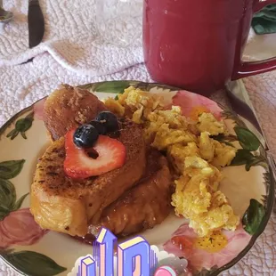 Delicious stuffed French toast with a bourbon maple syrup, eggs, pastries, and fresh fruit. Coffee was delicious too!