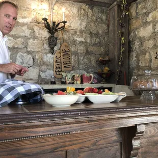 Paul, the owner, and a delicious array of fresh fruit and coffee cake