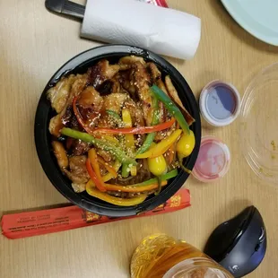 a bowl of chicken and peppers