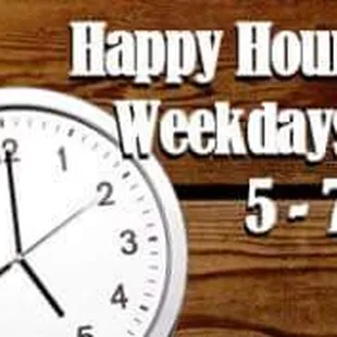 a clock on a wooden table