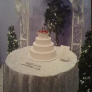 Wedding cake photo 17 years ago. Traditional 4-tiered white almond wedding cake, with butter cream frosting.