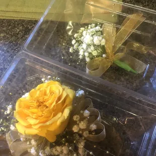 a yellow rose and baby's breath