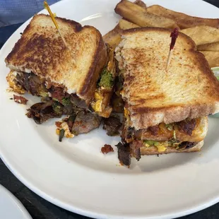 a grilled cheeseburger and french fries