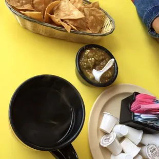 Cup of coffee and chips &amp; salsa