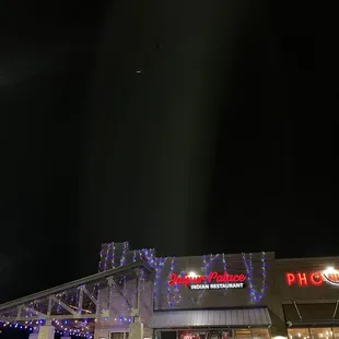 the exterior of the restaurant at night