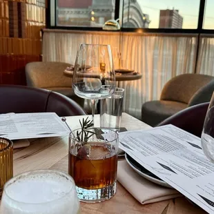 a glass of wine and a glass of beer on a table