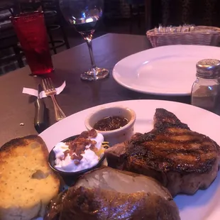 16 oz pork chop, loaded baked potato (we requested toppings on the side).