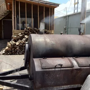 Smoker and wood pile