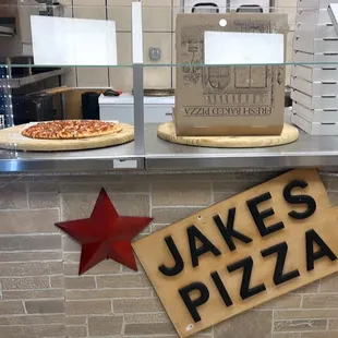 a sign that says jake&apos;s pizza