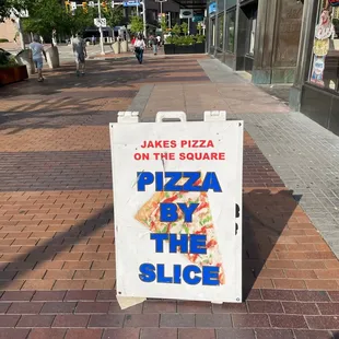 a sign on the sidewalk