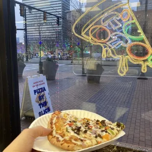 Philly cheese slice, they warm it up in an actual pizza oven, not a microwave.