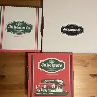 three pizza boxes