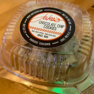 a chocolate chip cookie in a plastic container