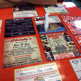Ads in booth table tops.  But they do have real creamer not the powder kind.