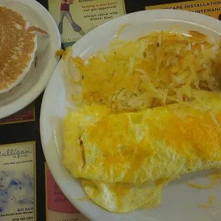 Tomato &amp; Cheese Omelette with hash browns and three pancakes