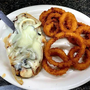 Smothered chicken with grilled onions, mushrooms and topped with melted swiss cheese!