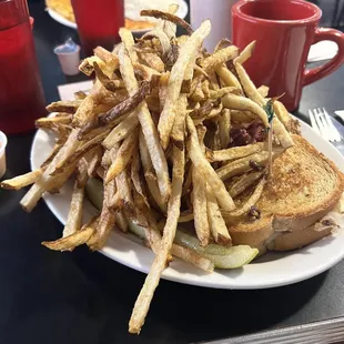 Reuben sandwich comes with fries! Pickle.. yes, the sandwich and pickle or under there call