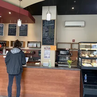 a woman standing at the counter