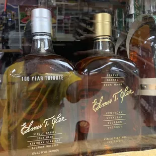 a variety of bottles in a store window