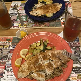 Cajun Barramundi on a thick bed of wild rice with veggies