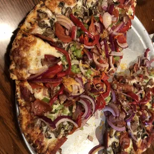 Large Custom Pizza with pepperoni, bacon, mushrooms, red onions, red bell peppers, and green bell peppers.