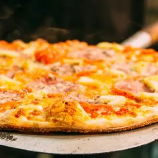 a pizza being cooked in the oven