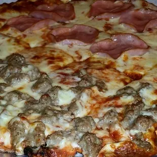 a pizza with meat and cheese