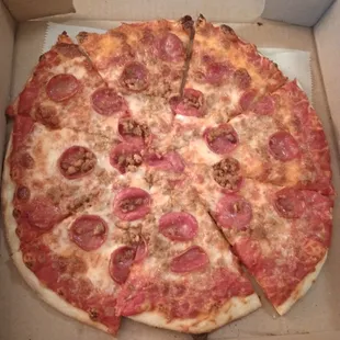 $14 two toppings 9" pizza. Undercooked crust