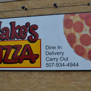 a large sign on a brick building