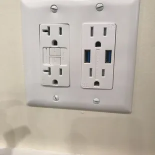 Phone charger outlets in the booths.
