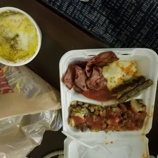 a meal in a styrofoam container