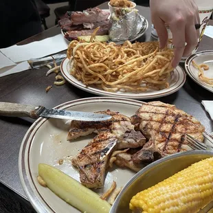 Pork chops corn on the cob ribs fries
