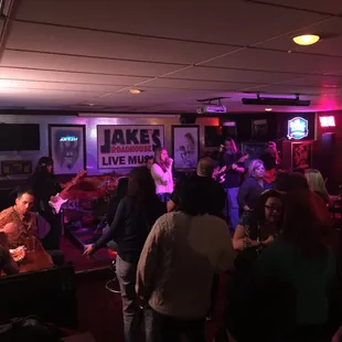 a group of people playing live music