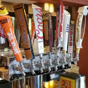 a row of beer taps