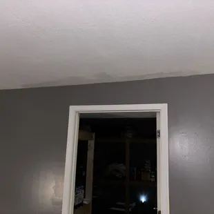 Replaced This water damaged ceiling and walls and repainted it to match.
