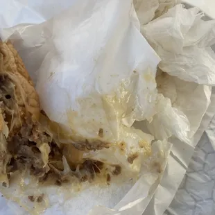 Paper wrapped all over the cheese and meat!