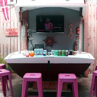 Jake's back patio Sloop Bar.  With no bar seating during Covid, we use the inside of the boat for guest seating.  Welcome aboard, Captain!