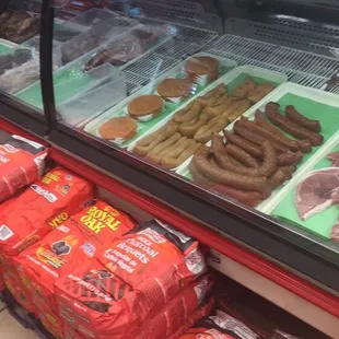 a display of sausages and meats