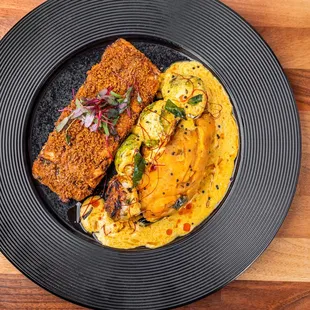 Tuticorin Grilled Salmon (d) 
A South Indian, Tuticorin Region, specialty with coconut &amp;
southern spice crusted salmon, masala potatoes a