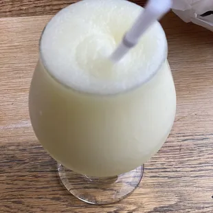 a drink in a glass with a straw