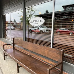 a bench in front of a restaurant