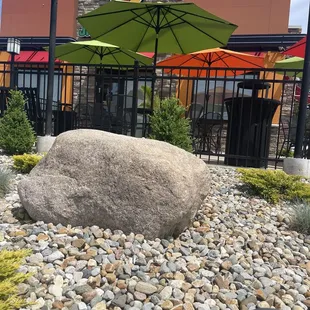a rock in front of a restaurant