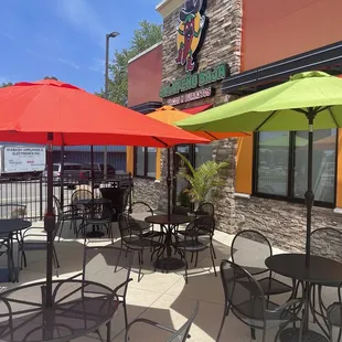 tables and umbrellas outside a restaurant