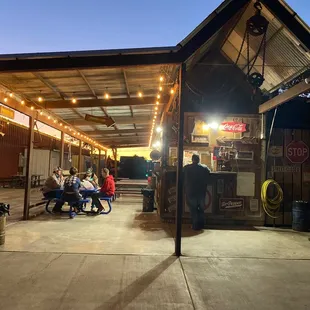 people sitting outside a restaurant