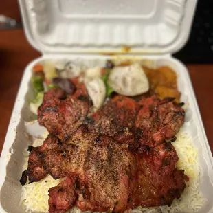 a meal in a styrofoam container