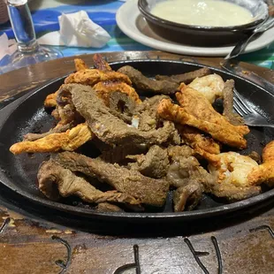 Grilled chicken, steak and shrimp Fajitas