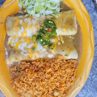 Green chili chicken enchiladas with rice for lunch