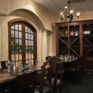 a dining room with a table and chairs
