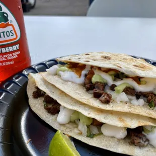 Asada Quesadilla with onion, cilantro, guacamole and crema for $8